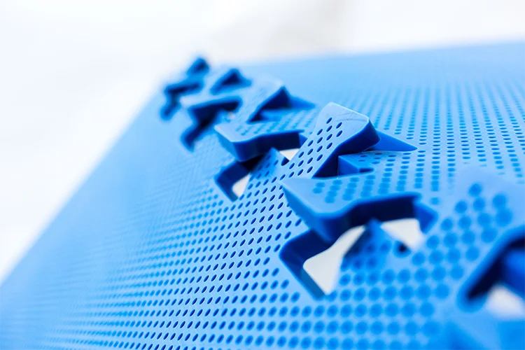 close-up of OctoFrost blue perforated bedplates showing puzzle lock connection