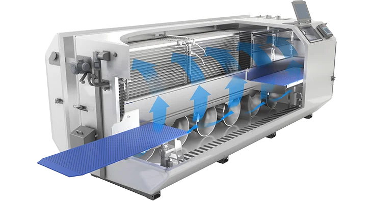 Cutaway view of the OctoCore IQF freezer highlighting its internal airflow system. Blue arrows indicate the even, upward flow of cold air circulating around the product zone for efficient and uniform freezing. The machine features a modular, stainless steel design with a control panel and perforated conveyor belt sections.