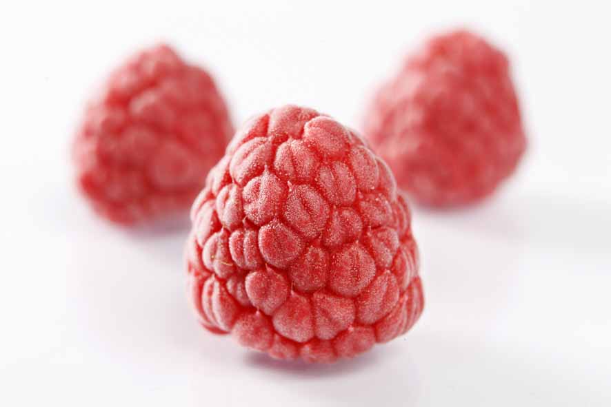 IQF frozen raspberries close-up