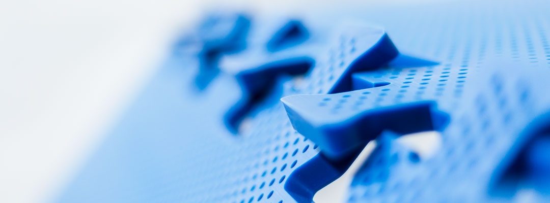 close-up of OctoFrost blue perforated bedplates showing puzzle lock connection